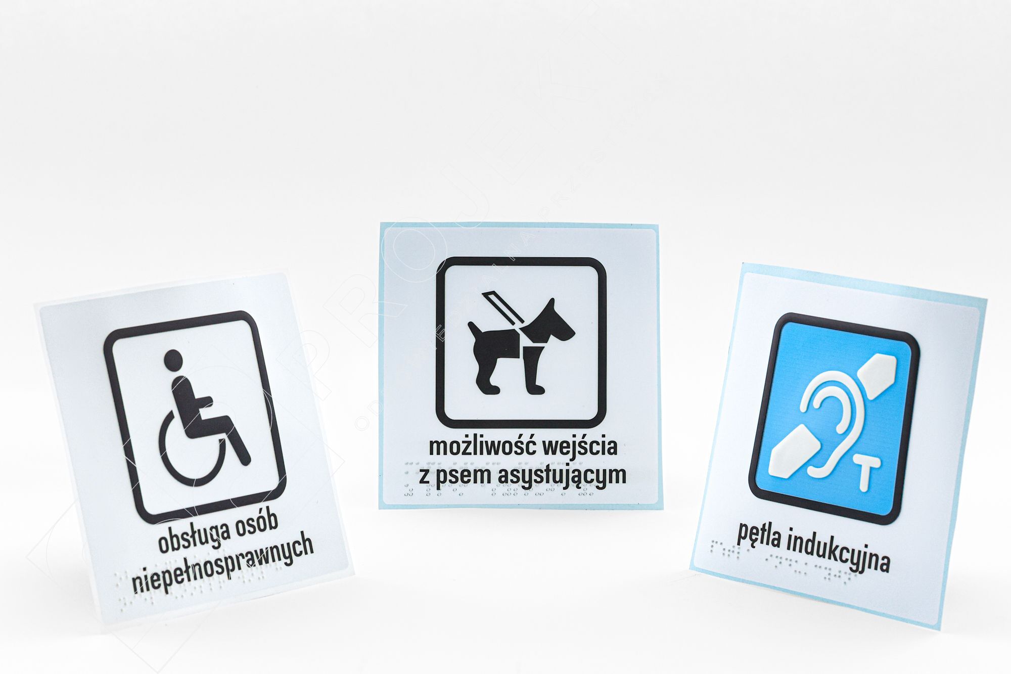 S2NW-Naklejki informacyjne z alfabetem Braille’a i piktogramem to kluczowe elementy informacyjne ułatwiające samodzielne poruszanie się osobom niewidomym i słabowidzącym. Zawierają wypukłe napisy, piktogramy, cyfry itp.